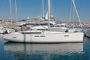 A marina with several sailboats docked, including a white yacht with 'EUROMARINE' on its side. - Sun-Kissed Sailing Adventure in Split, Croatia (Split)