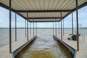 A covered dock with a view of the water. - Game Room, Fishing & Dock on Grand Lake! (Grove)
