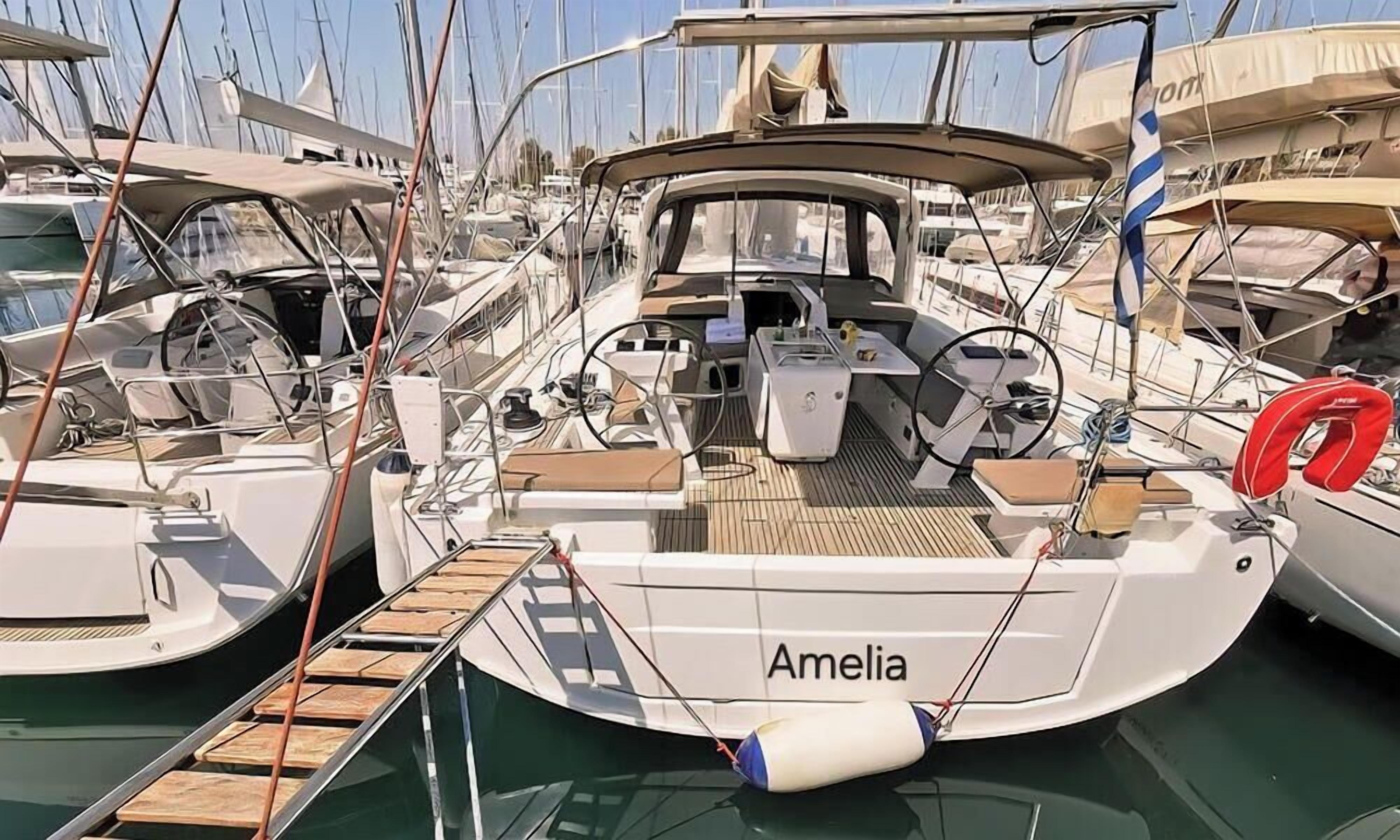 A marina with boats docked, including one named 'Amelia' with a wooden deck and a steering wheel.
