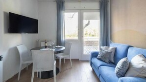 Living area - Wallpaper Suites – 2 Bedrooms, 2 Bathrooms, and a Small Balcony (Padova)