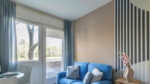 Living area - Wallpaper Suites – 2 Bedrooms, 2 Bathrooms, and a Small Balcony (Padova)