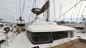 A sailboat with a covered deck area, multiple masts, and a cabin structure. - Sun-kissed Sailing Adventure in Split-Dalmatia, Croatia (Trogir)
