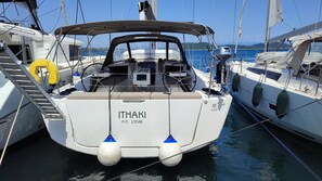 A yacht named 'ITHAKI' with a cabin, a steering wheel, and a lifebuoy. - Sun-kissed Sailing Adventure in the Ionian Islands (Preveza)