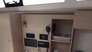 A compact, well-lit cabin with a desk, a bed, and a small shelf with books. - Sun-Kissed Sailing Adventure in the Ionian Islands, Lefkada (Lefkada)