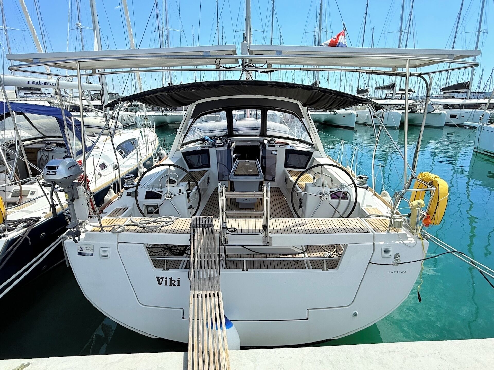 A marina with a sailboat named 'Viki' docked.