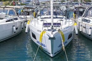 A marina with boats docked, including one with 'ANGELINA' written on it. - Sun-Kissed Sailing Adventure in Sibenik, Croatia (Primošten)