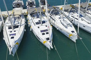 A marina with multiple yachts docked closely together. - Sun-Kissed Sailing Adventure in Zadar, Croatia (Bibinje)