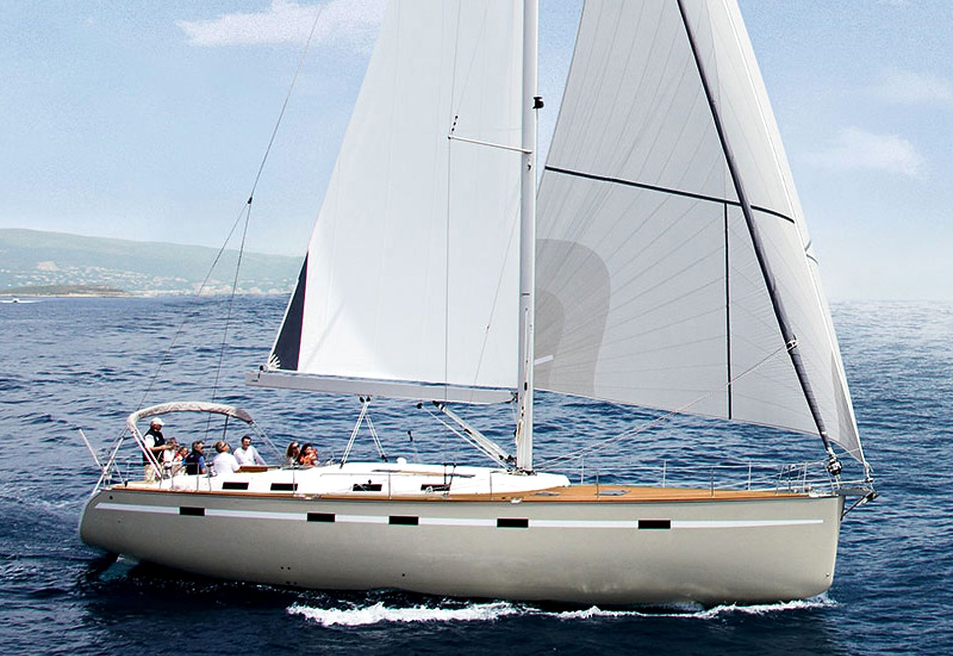 A sailboat with a cabin and deck seating, sailing on a body of water.
