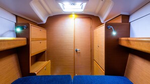 A compact interior with a central door, two side compartments, and a skylight. - Sun-Kissed Sailing Adventure in the Ionian Islands, Lefkada (Lefkada)