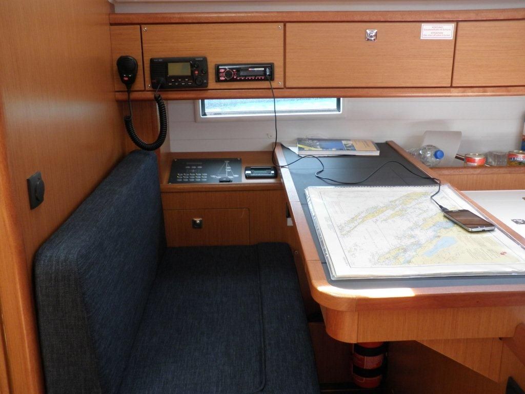 A compact kitchenette with a microwave, a small refrigerator, and a coffee maker.