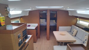 A compact galley with a stove, sink, and storage cabinets. - Sun-Kissed Sailing Adventure in the Ionian Islands, Lefkada (Lefkada)
