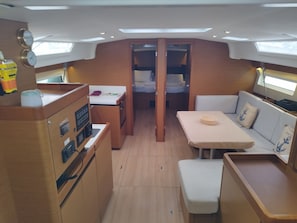 A compact galley with a stove, sink, and storage cabinets. - Sun-Kissed Sailing Adventure in the Ionian Islands, Lefkada (Lefkada)
