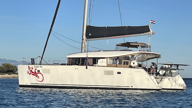A large yacht with a white hull, a red logo, and a Dutch flag. - Sun-Kissed Sailing Adventure in Northern Croatia (Punat)