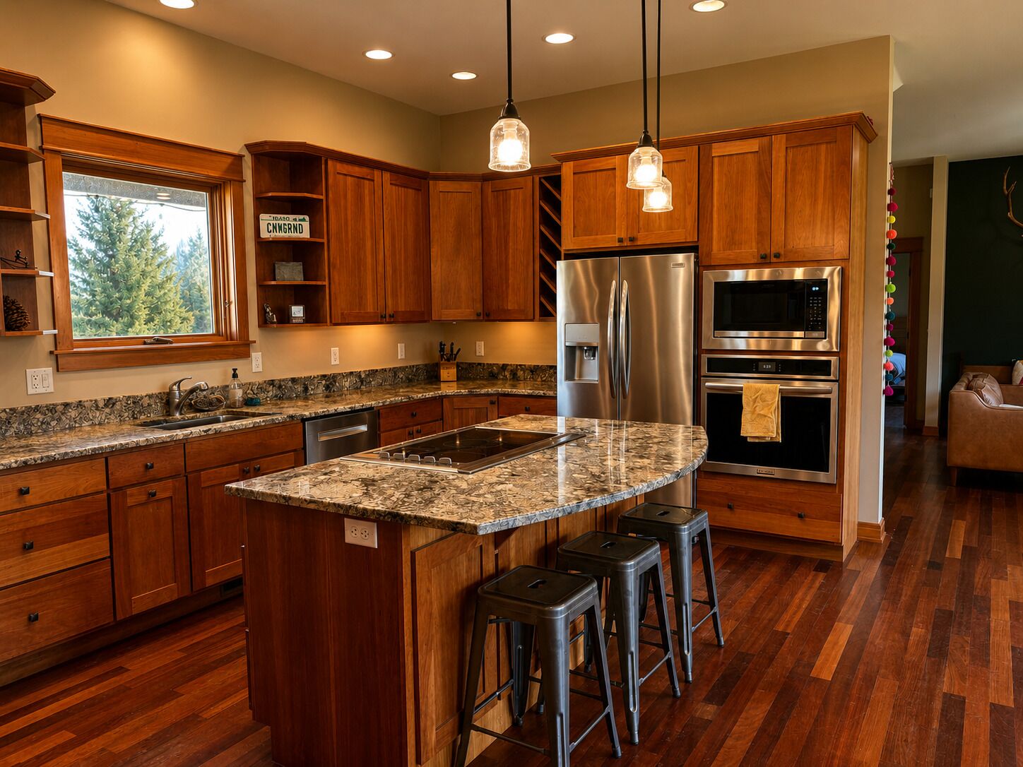 A modern kitchen with wooden cabinets, stainless steel appliances, and a granite countertop.