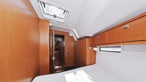 A compact, well-lit interior with a wooden panel wall, a white ceiling, and a small window. - Sun-Kissed Sailing Adventure in Zadar, Croatia (Zadar)