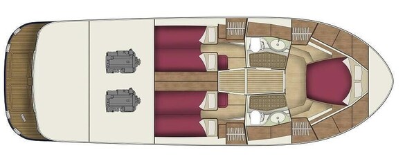 A boat interior with a central dining table, two sofas, and a small kitchen area. - Sun-Kissed Sailing Adventure in Zadar, Croatia (Bibinje)