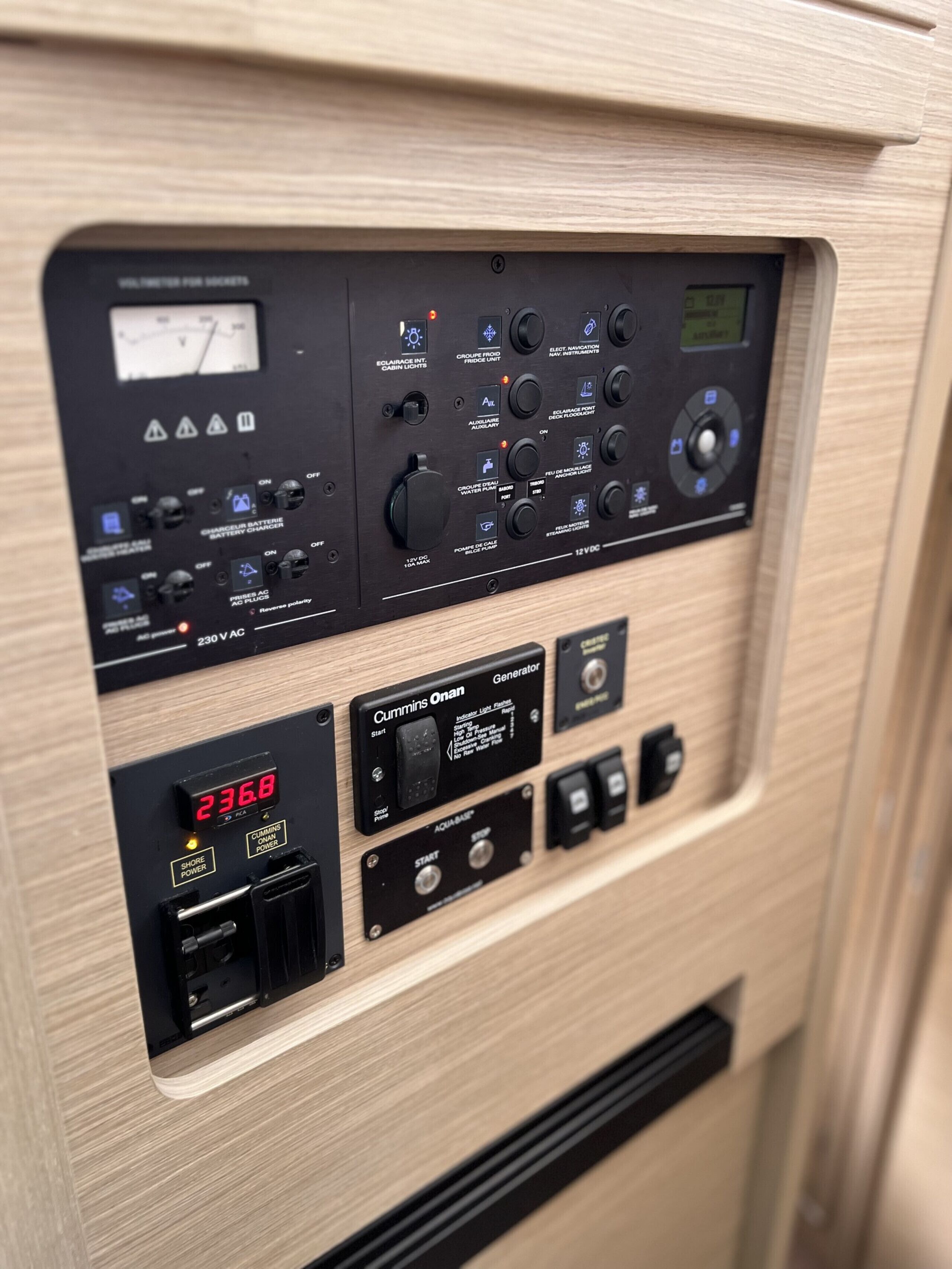 A control panel with various switches and indicators, including a digital display showing '236.8'.