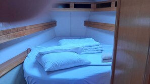 A bunk bed with white bedding and wooden headboards. - Sun-kissed Sailing Adventure in Split-Dalmatia, Croatia (Trogir)