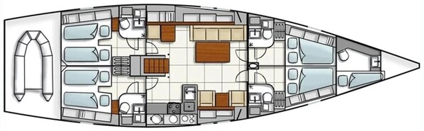 L'intérieur d'un bateau comprend une cuisine, un coin repas et plusieurs cabines.