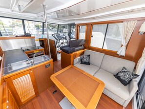 A compact galley with a sink, stove, and storage cabinets. - Sun-Kissed Sailing Adventure in Zadar, Croatia (Zadar)