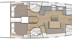 Bootinterieur met een eethoek, keuken en zithoek.