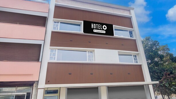 A multi-story hotel with a sign reading 'HOTELO Company Serviced.' - Saver Double Hotel O Chandigarh Road (Dera Bassi)