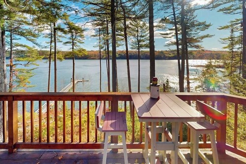 Charming Riverfront Home With Cozy Interiors, Dock, and Scenic Deck Views