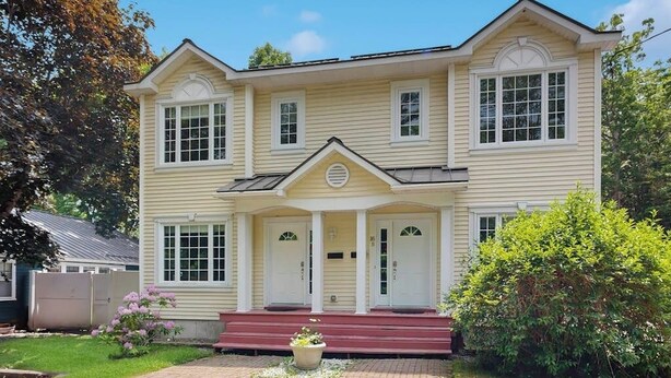 A two-story house with a front porch, a driveway, and a well-maintained lawn. - Ideally Located Home w/ Deck, Wifi & Washer/dryer - Walk Into Town & Acadia (Bar Harbor)