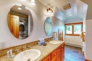 A bathroom with two sinks, a large mirror, and a window. - Delightful Oceanfront Home With Amazing Views, Wrap-around Deck & two Fireplaces (Westport Island)