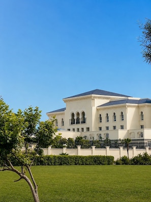 A large, white building with a symmetrical facade, multiple windows, and a central entrance. - Lancaster Palace Tamuda Bay (Marina Smir)