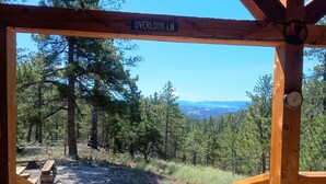 A wooden structure with a sign reading 'OVERLOOK LN.'