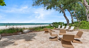 A beachside lounge with wicker chairs and a view of the ocean. - Luxury oceanfront home w/ pool, spa, free parking (Holmes Beach)