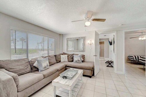 Serene oceanfront suite with Gulf view, grill, patio, central AC, & WD