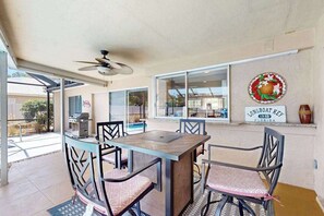 Outdoor dining - Dog-friendly house with pool, lanai, firepit, grill, patio, & enclosed backyard (Sarasota)