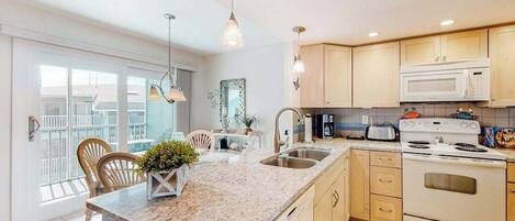 Coffee/tea maker, fridge, microwave, oven