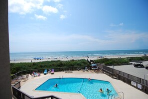 A pool area with a view of the beach and ocean. - Land's End Resort - Oceanfront Views & Resort Amenities (Myrtle Beach)