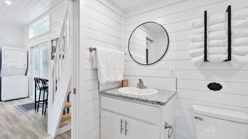 Shower, hair dryer, towels, shampoo