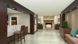 A modern interior with a stone fireplace, a bar area, and seating.
