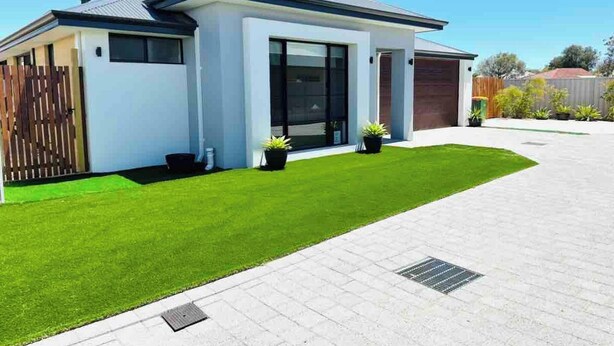 A modern two-story house with a flat roof, large windows, and a well-maintained lawn. - Busselton Stylish 5 Bed, 3 Bathroom Home (Busselton)