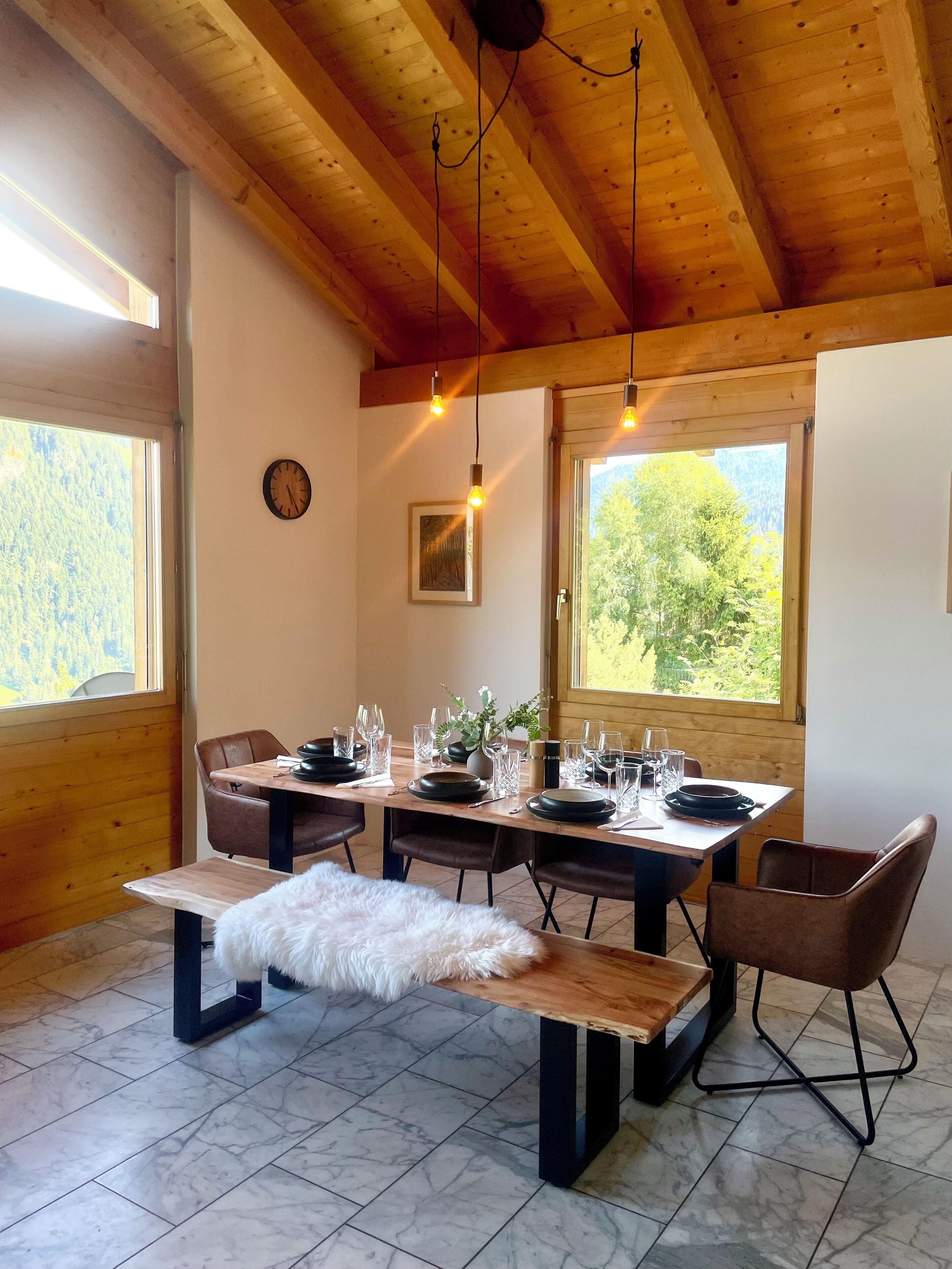 Bright rustic dining area with mountain views and cozy chalet charm