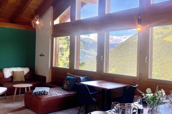 Soaring wood ceilings and panoramic mountain views from the dining room
