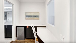 A compact kitchen with a refrigerator, a small sink, and a window. - Dixie Tide - Hammock Dunes West (Orange Beach)