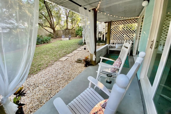Private Patio overlooking tropical garden with small pond.