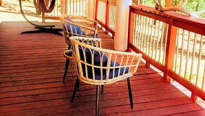 A wooden deck with wicker chairs and a hammock. - The mountains are calling. Enjoy the perfect balance of serenity and adventure. (Westcliffe)
