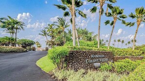 A sign for Waikoloa Colony Villas with a paved road and palm trees. - *NEW* Fall Special Pool and Tennis Days Near Anaeho'omalu Bay (Waikoloa)