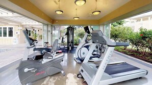 A gym with treadmills, elliptical machines, and weight equipment. - *NEW* Fall Sale Garden-Level Fairway Stay by Kings' Shops and A-Bay (Waikoloa)