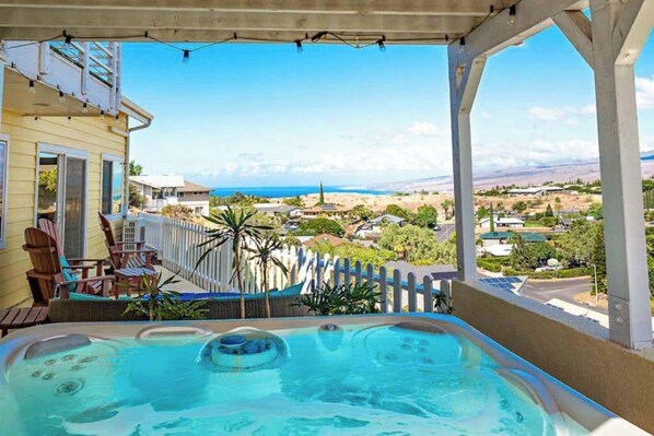 A hot tub on a balcony with a view of a coastal landscape. - NEW Fall Sale Private Waikoloa Home with Coastal Views and Hot Tub (Waikoloa Village)