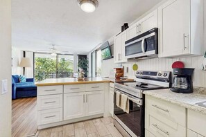 Coffee/tea maker, fridge, microwave, oven - Chic Oceanfront Kona Condo with Wraparound Lanai & Resort Pool (Kailua-Kona)