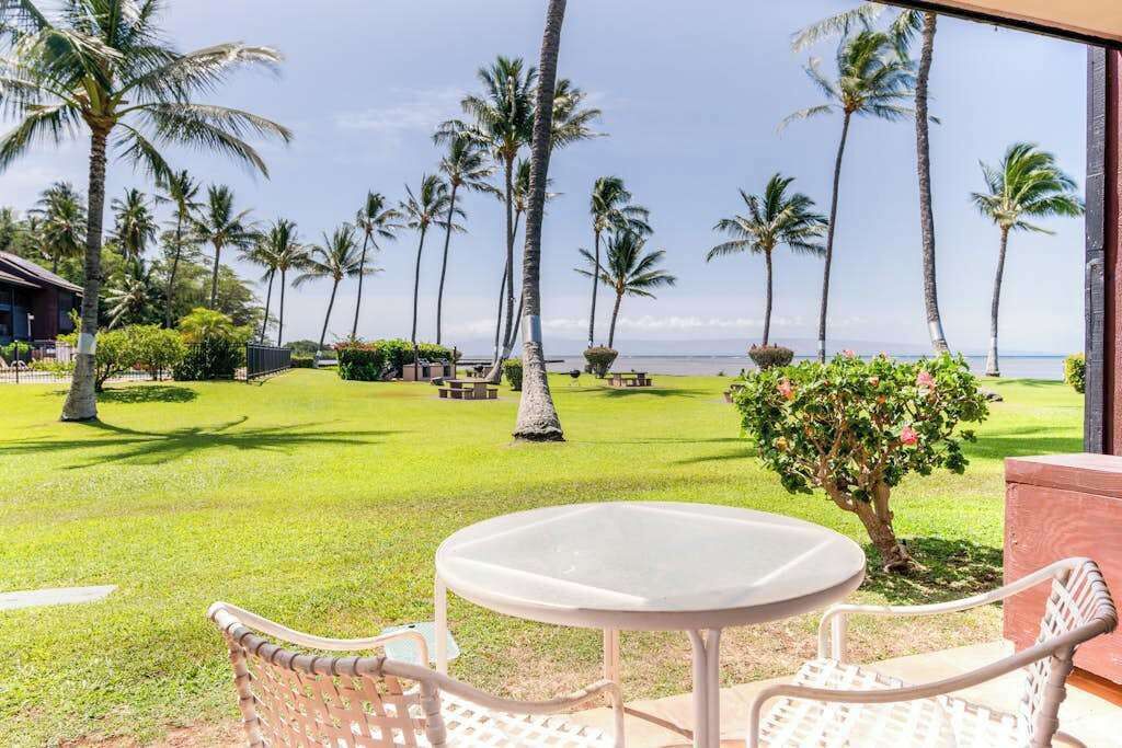 Tropical resort grounds surround comfortable outdoor spaces with inviting island views