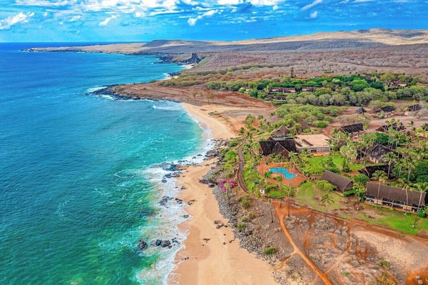 Nearby Molokai coastline features turquoise waters and rugged island scenery